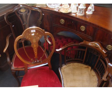 AN EDWARDIAN MAHOGANY ARMCHAIR, with inlaid brass decoration, with two other Edwardian chairs and an upholstered stool