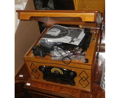 A VINTAGE STYLE RECORD PLAYER AND CD PLAYER in a pale wood cabinet