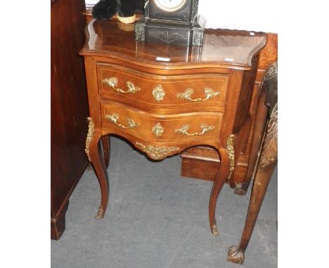 A REPRODUCTION LOUIS XV COMMODE,  fitted two drawers with gilt mounts 26" wide