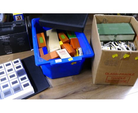 Two boxes of vintage projector slides, loose and in folders and cases