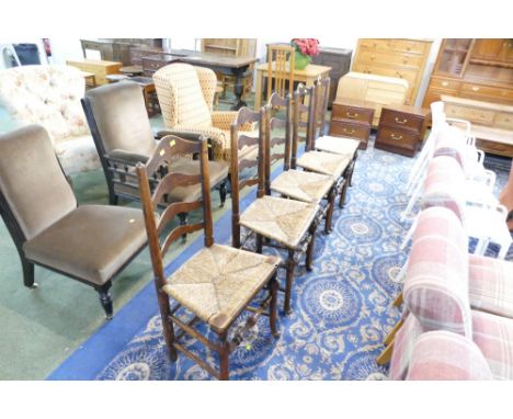 Five 19th century rush seated ladder back dining chairs