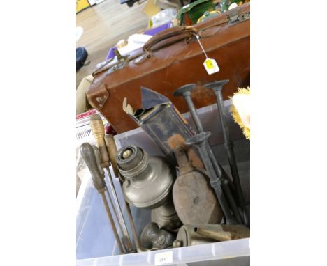Vintage suitcase and box of meat grinder, oil lamp, metal candlesticks, vintage hand tools etc