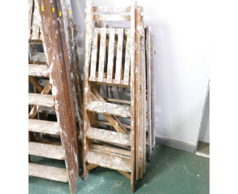 Three pairs of low vintage wooden step ladders