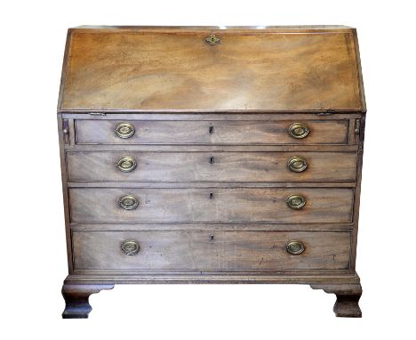 19th century mahogany bureau with fall flap enclosing drawers and pigeon holes, over four long graduated drawers on ogee brac
