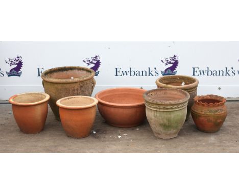 Collection of seven terracotta garden planters, to include one of urn form with twin handles, h33cm diameter 39cm, a pair of 