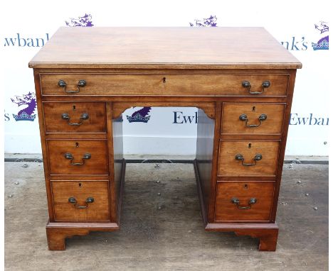 19th century mahogany desk with a single drawer and six short drawers on bracket feet, h77 x w89 x d55.5cm, 