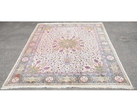 Large Persian Tabriz carpet, with Sheikh Safi design having floral decoration on a cream ground within floral borders, with p