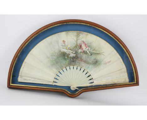 H Bach, Madrid, a 19th century fan with carved ivory guard stick, the chicken skin leaf hand painted with a fashionable coupl