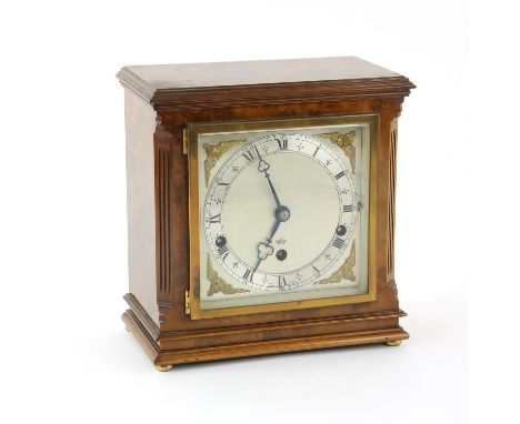 Elliott walnut cased 8-day Westminster / Westminster-Whittington chime clock, with square silvered dial with Roman and Arabic