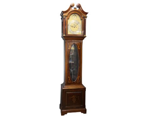 Early 20th century mahogany and marquetry inlaid eight day longcase clock, the arched brass dial with mounted brass scrolling