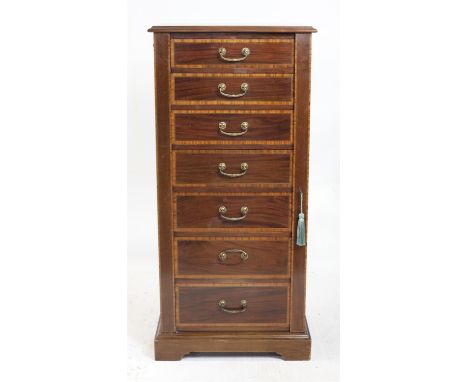 Early 20th century mahogany and satinwood banded Wellington Chest of seven graduated drawers on plinth base and bracket feet,