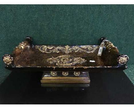 A decorative twin handled trough