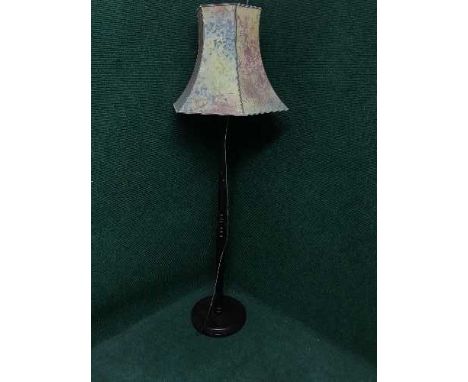 A mahogany standard lamp and shade