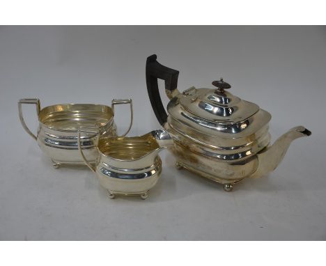 A heavy quality three piece silver tea service in the Regency manner, on ball feet, William Hutton &amp; Son Ltd, Jubilee mar