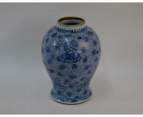 A 19th century Chinese blue and white baluster jar with short cylindrical neck, painted in underglaze blue with a lappet band