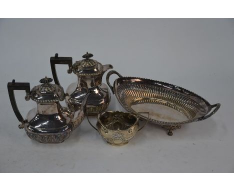 An Edwardian silver oval sugar basin with twin handles, Birmingham 1904, 4oz, to/w an epns cafe au lait pair and an oval frui