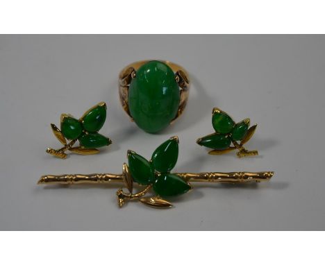 An oval cabochon green jade ring set 9ct yellow gold, size P to/w a yellow metal bar brooch in the form of a bamboo branch wi