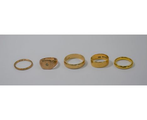A collection of five various rings - a 22 carat yellow gold wedding band, size P, approx 6.1g; a wide 18ct yellow gold weddin