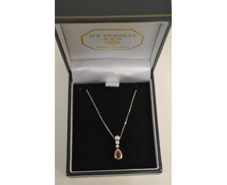 A modern diamond and ruby set pendant, yellow and white gold set, with fine white metal box link chain stamped 375, approx 2.