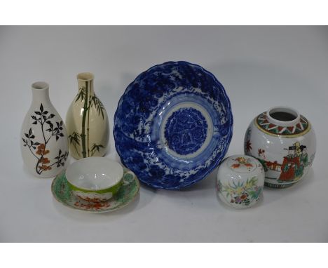 A small collection of 19th and 20th century Asian ceramics including a small famille verte ginger jar decorated with official