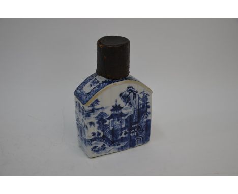 An 18th century Chinese blue and white caddy, the ribbed sides painted with landscapes and dwellings in underglaze blue, Qian