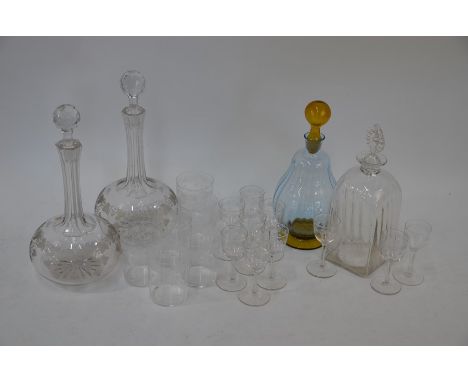 A pair of Victorian long neck decanters, the hexagonal cut neck finely notched along its length, the main body etched with fr