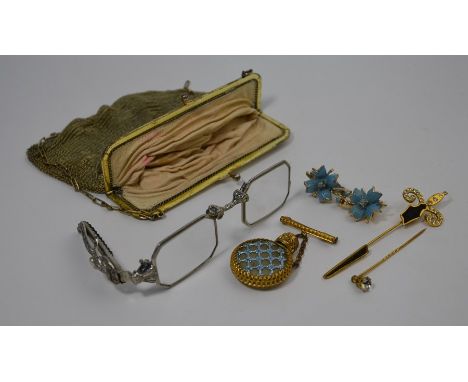 A collection of accoutrements including a mesh purse, lorgnettes, stick pin, earrings and a scent bottle