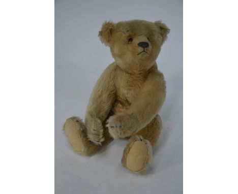 A vintage Steiff teddy bear with moving head and limbs, stud to ear, 31 cm highNo holes to paw pads, growler within but does 