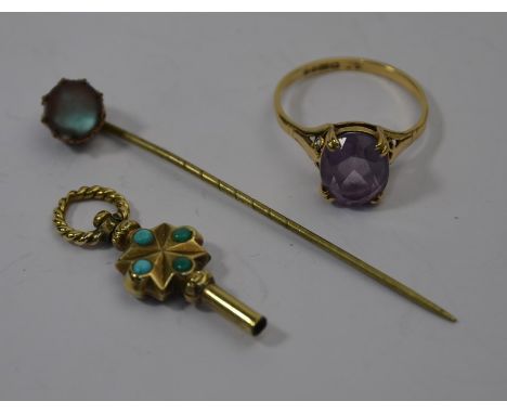 A 9ct yellow gold ring set with oval amethyst; a turquoise set watch key and a stick pin (3)