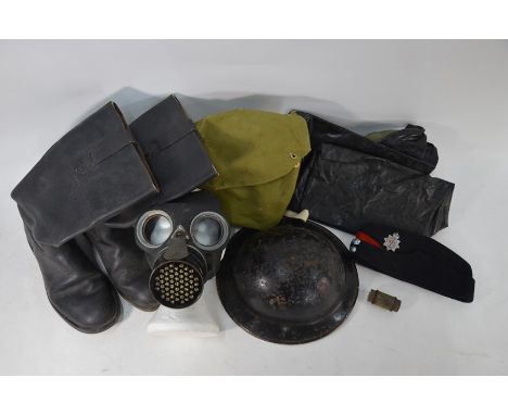 WW2 fireman's kit including steel helmet, forage cap, leather boots, oilskin chaps, gas-mask and tube of Anti-Dim gas-mask le