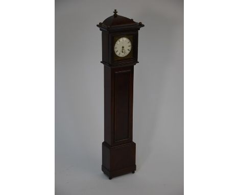 An early 19th century mahogany miniature longcase clock watchstand with brass ball finials and feet, 40 cm high, the hood con