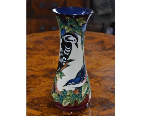 A contemporary Moorcroft tall vase decorated with the 'Ingleswood' pattern, designed by Philip Gibson, 30 cm high, 2003, c/w 