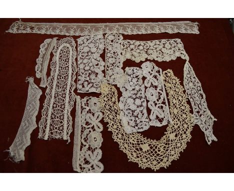 A collection of 19th century and later mostly needle-run lace pieces to/w a selection of Brussels and other bobbin lace and a