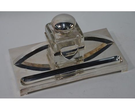 A WMF electroplated inkstand, the cubic cut glass inkwell with hinged electroplated bun cover, c.1910-1920, 30.5 cm wide