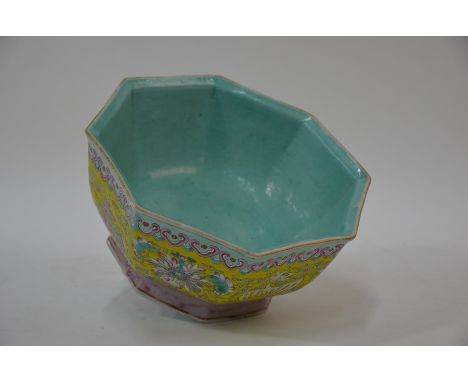 A Chinese octagonal famille rose bowl, the interior covered with a pale turquoise glaze, the exterior painted with a band of 