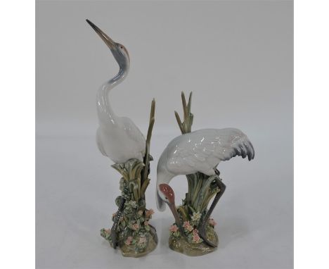 Two Lladro models:  Dancing Crane, 1614 and Bowing Crane, 1613, c/w boxes (2)Dancing crane - one leaf damaged.Bowing crane - 