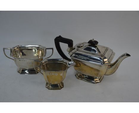 A heavy silver three piece tea service on raised moulded foot rim, Birmingham 1937, 29.3 oz gross&nbsp;&nbsp;