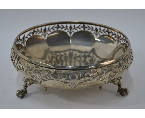 A heavy quality silver fruit bowl with foliate-pierced rim, on three winged claw and ball feet, Cooper Brothers &amp; Sons, S