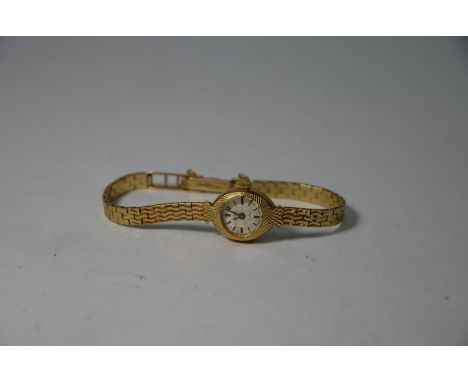 A lady's 9ct gold Rotary wristwatch with 21 jewel movement, in scale-textured case on wavy bricklink bracelet, London 1965, 1