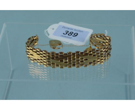 A 9ct gold gate link bracelet with heart shaped padlock clasp plus a small 9ct gold St Christopher charm, weight approx 17g