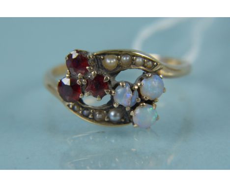 An unmarked yellow metal opal, garnet and seed pearl set ring (one opal damaged), size M, weight approx 2.5g