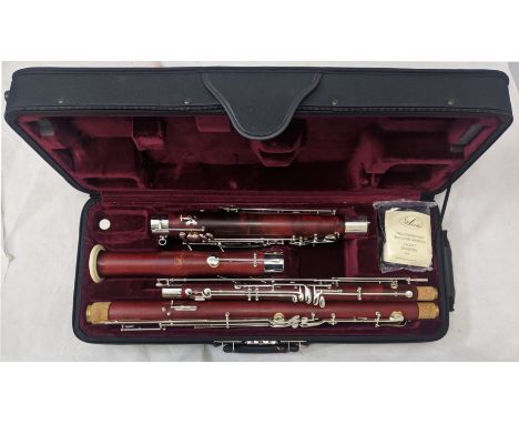 Schreiber S13 Bassoon with original case.  Note: Bassoon is stamped S16 as per photograph, the Schrieber paperwork and spec s