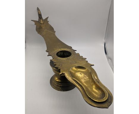 A late 19th/early 20th century Indian cast brass oil lamp with oil container,Kerala,South India,  L.50cm
