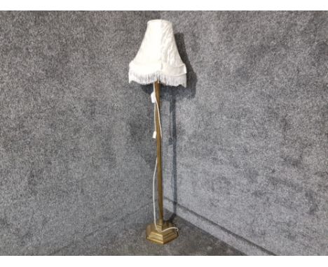 A Victorian brass telescopic standard lamp with modern cream tassled shade.