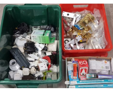 A quantity of door handles, light bulbs and electrical items in three boxes.