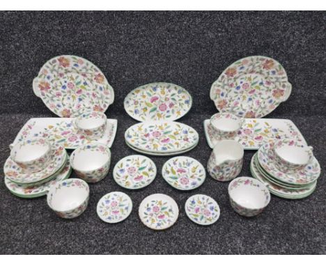 A part tea service by Minton "Haddon Hall" pattern, to include tea cups and saucers, sandwich plates etc, overall good condit