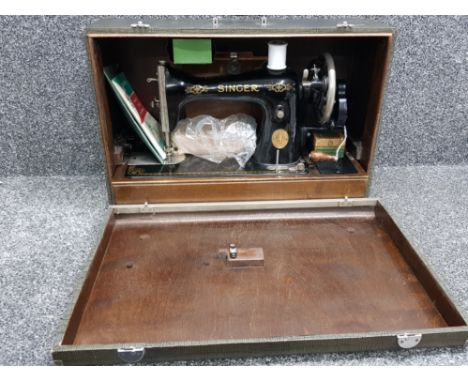 Vintage Singer sewing machine with original carry case