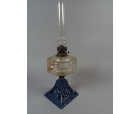 A Late Victorian Cast Iron Based Oil Lamp with Glass Reservoir. 