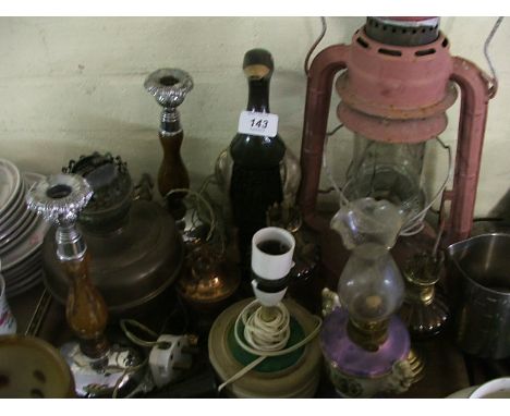 A Tray Containing Oil Lamps Candle Sticks Hurricane Lamp etc.