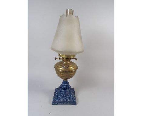 A Late Victorian Brass and Cast Iron Based Oil Lamp. 